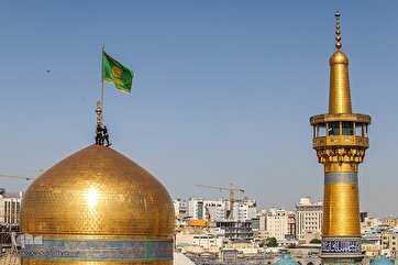 Mashhad Shrine’s Flag Replaced on Imam Reza Birth Anniversary